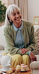 Senior woman, smile and tea party in house, connection and conversation with friends in living room. Happy, mature person and discussion with coffee in lounge, gossip and relax with dessert in home