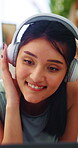 Dance, laptop and music with happy woman on floor in home for audio or sound streaming. Computer, headphones and smile with person in apartment for online entertainment, rhythm or subscription