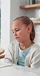 Child, upset and thinking with homework in home for learning disability, fatigue and mistake. Sad, bad and girl with notebook for education, dyslexia or adhd with academic challenge in family house