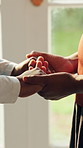 Caregiver, holding hands and woman at house with comfort, compassion and empathy for diagnosis. Nurse, consoling and person with depression, emotional support and understanding for medical treatment