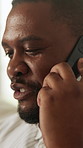 Black man, conversation and phone call in home for communication, relax and social connection on weekend. Male person, happy and mobile chat in living room for gossip, news and story in house