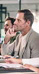 Boardroom, discussion and businessman with team, listening or brainstorming for investment proposal. Business, collaboration and person with colleagues, meeting and strategy for funding opportunity