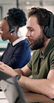 Help, support and man with headset in agency for customer service or online advice in office. Contact us, coworking or agents with smile for virtual assistance, CRM or communication in call center