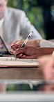 Businesswoman, hands and writing in meeting with notebook, minutes or planning for accounting report. Admin, person and taking notes in office with diary, finance team and bookkeeping tasks to do.