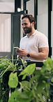 Man, laugh and phone in office with break, sustainable company or funny AI meme for go green project. Happy, person and typing in corridor with tech, social media and joke for eco friendly business.