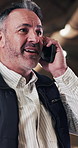 Phone call, man and carpenter in workshop for contact on furniture manufacturing with order. Happy, cellphone and mature woodworker on mobile discussion for feedback on industrial project in factory.