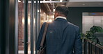 Business, walking and man with leaving, office exit and time management in workplace routine. Corporate, back and employee in agency with stroll, closing and workspace departure at end of day.