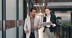 Tablet, talking and walking with business people in office corridor for planning or research. App, review and schedule with happy team in workplace hallway for collaboration or digital agenda