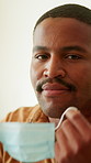 Face, man and remove mask in home for post illness recovery, infection control and safety. Happy, black person or take off protection in house for viral clearance, healing or end of respiratory virus