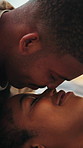 Happy, relax and couple with nose touch in home with bonding, love and trust in relationship. Smile, commitment and African man with woman for eskimo kiss with connection, affection or marriage care.