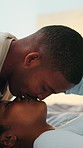 Love, couple and kiss in home for connection, trust and relationship commitment with happy partner. Smile, black man and woman with romantic moment at bedroom, affection and devotion with support