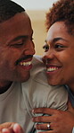 Love, happy or couple on bed with cuddle, partner trust or bonding together in connection. Smile, security or black people in home with comfort, romantic moment or commitment in healthy relationship.
