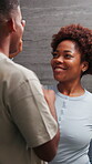 Laughing, lotion and morning with black couple in bathroom of home together for dance or love. Funny, holding hands and skincare with happy people in apartment for bonding, moment or security