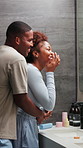 Couple, skincare and hug in bathroom for morning routine, self care and face cream product. Black man, woman and happy marriage in home with beauty, lotion and cosmetics with love in relationship