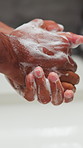 Hygiene, wellness and washing hands in bathroom with soap, bacteria safety and germ prevention. Person, sink or cleaning fingers with foam for protection, antibacterial or skincare for health in home
