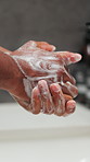 Hygiene, health and washing hands in bathroom with soap, bacteria safety and germ prevention. Person, sink or cleaning fingers with foam for protection, antibacterial or skincare for wellness in home