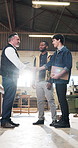 Carpentry, handshake or men in workshop with inspection, building deal or greeting in safety check. Flare, people or carpenters with shaking hands, partnership introduction or approval in compliance.