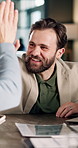 Happy, man and high five in office with team, laptop and collaboration for business profit goals. People, smile and celebration in workplace with computer, revenue growth and partnership for success.