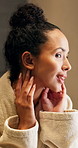Skincare, beauty and woman by mirror in home with cosmetics, health or facial wellness in morning. Happy, inspection and person checking for acne, marks or pimples on face for dermatology in house.