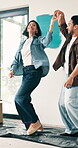 Dance, love and painting with happy couple in new home for diy improvement, makeover or renovation. Maintenance, music and property investment with excited people in modern apartment for remodeling
