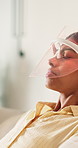 Skincare, red light and woman with mask for facial benefits, beauty or relax with tech in home. Dermatology, anti aging or person with infrared skin treatment, collagen production or LED phototherapy