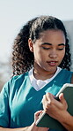 Nurse, student and woman with tablet, outdoor and academic project preparation with research on web. Clinical trainee, online and person with tech for medical report, study and scroll healthcare info