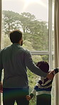 Window, curtain and back of dad with child in home to start day, morning routine and sunlight. Family, oepn and father with boy for view, sunshine and trees for fresh air, wellness and bonding