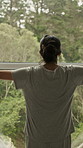 Window, stretching and back of woman in home to start day, morning routine and sunlight. House, accommodation and person open curtains for view, sunshine and nature for fresh air, wellness or weather