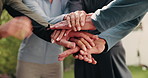 People, unity and hands together in backyard for fitness, exercise or outdoor mission with trust. Health, active group or piling with stack, synergy or community in huddle for wellness or teamwork