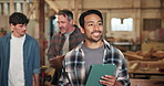 Tablet, carpenter and man planning in factory for manufacturing, smile and walking with team. Tech, woodwork and happy person with idea for joinery production, craft or thinking of project update