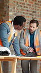 Men, architect and planning on construction site for building design, safety or security together. Male people, contractor or civil engineer with blueprint for brainstorming or architecture project