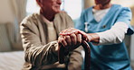 Caregiver, hands and old man in retirement home with cane, support and help for injury rehabilitation. Nurse, walking stick and elderly person with disability, assistance and healing for arthritis.