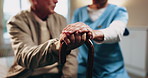 Senior, man and caregiver hands with cane, support and assistance for rehabilitation in nursing home. Nurse, help and elderly person with disability, walking stick and injury recovery in retirement.