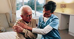 Talking, nurse and shoulder pain of senior man in home for healthcare, elderly support or wellness. Retirement, caregiver and old person with patient care, homecare and stiff joint with arthritis