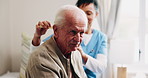 Caregiver, grooming and old man in nursing home with comb, support or assistance with conversation. Volunteer service, elderly person and happy in retirement center with hair care, chat and kindness.