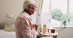 Bible, prayer and senior man in bedroom for morning prayer, worship study or Christian faith in home. Reading, religion and elderly person on bed with holy book, gospel or spiritual guide in house