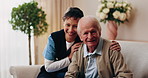 Face, caregiver and old man in retirement home with smile, support and healthcare for rehabilitation. Happy, nurse and elderly person on couch with assisted living, kindness and medical assistance.