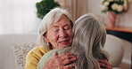 Smile, old woman and friends at house with hug, welcome and bonding together for reunion. Happy, senior people and talking in lounge with embrace, friendly affection and compassion for weekend visit