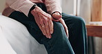 Hands, injury and old man in home with knee pain, medical problem and massage for arthritis symptoms. Senior person, legs and hurt in retirement with osteoporosis, joint inflammation or fibromyalgia.
