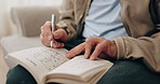 Senior, hands and writing with sudoku in home for fun activity, game or puzzle on sofa. Elderly, male person or number with book or blocks for cognitive problem solving, memory or concentration