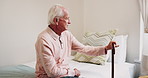 Mental health, thinking or old man in home with walking stick, introspection or insight in nostalgia. Reflection, flashback or senior person with disability, perspective or mindfulness in retirement.