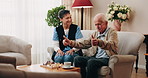 Caregiver, chess and old man in nursing home with thumbs up, bonding together and happy for match win. Nurse, senior person and success with board game, cognitive skills and retirement wellness.
