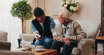 Caregiver, support and old man in nursing home with bible, share gospel and encouragement for faith. Nurse, senior person and conversation in retirement with holy book, spiritual belief and guidance.