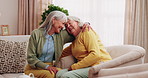 Happy, old women and friends at house with hug, welcome and bonding together for reunion. Smile, senior people and talking in lounge with embrace, friendly affection and compassion for weekend visit