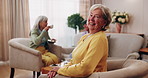 Face, laugh and old woman in home for relax, happiness and wellness with friends on weekend. Portrait, funny and senior person at living room with smile for resting, peace and calm in retirement