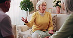 Friends, bonding and talk with old woman in home to relax together, funny story or smile for gossip. Retirement, people and chat at living room for conversation with happiness, laugh and socializing