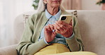 Phone, hands and senior woman on sofa in home for texting, notification or social media. Typing, relax and elderly person with cellphone for reading blog, update or email on mobile app in living room