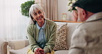 Talking, support and smile with old woman on sofa in home for chat, connection or bonding. Social gathering, reunion and retirement with senior friends in living room of apartment for solidarity