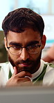 Thinking, creative and business man on laptop for strategy, planning and idea for digital marketing. Office, glasses and person on tech with reflection for brand promotion, email campaign or research