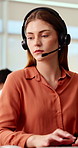 Woman, consultant and typing with headset in call center for customer service or online advice. Female person, agent or report with computer or mic for telecommunications, virtual assistance or help